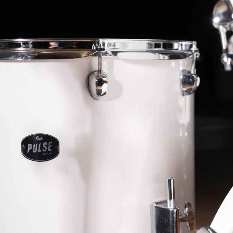 Close-up of a white drum shell with chrome hardware and a Pulse series badge ขายราคาพิเศษ