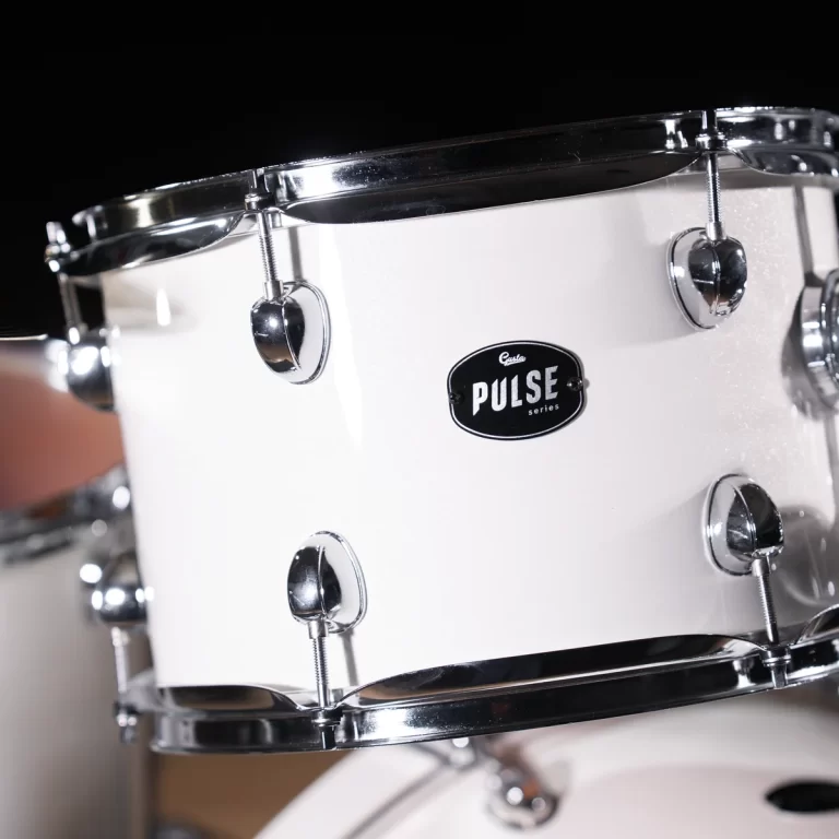 Close-up of a white snare drum with chrome hardware and a Pulse series badge ขายราคาพิเศษ