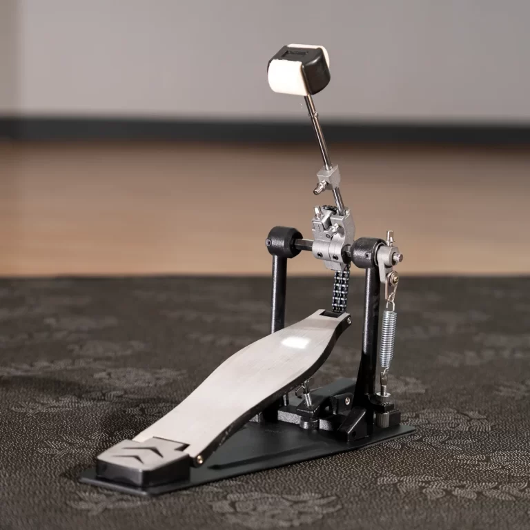 Single bass drum pedal with footboard, beater, and chrome hardware on a dark surface. ขายราคาพิเศษ