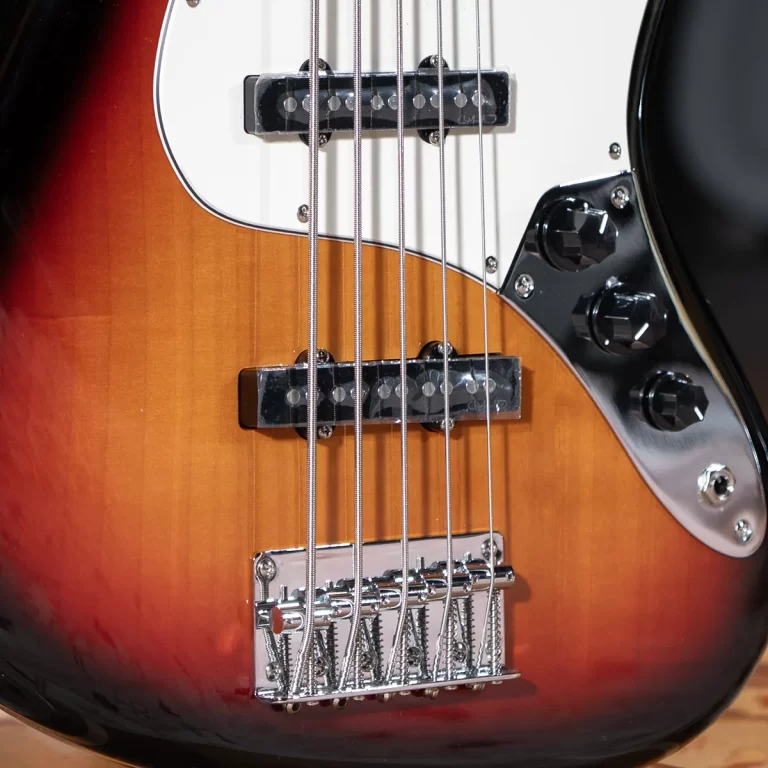 Close-up of a sunburst electric guitar body with two pickups, white pickguard, and a chrome bridge panel. ขายราคาพิเศษ