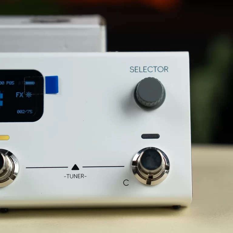 White audio equipment front panel with a large gray selector knob labeled 'SELECTOR' and a chrome tuner knob, plus a small display on the left. ขายราคาพิเศษ