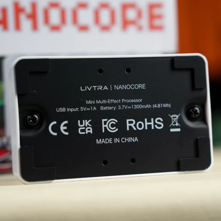 Back of a Livtra Nanocore mini multi-effect processor showing USB input, battery details, and certification marks (CE, UKCA, FC, RoHS). ขายราคาพิเศษ