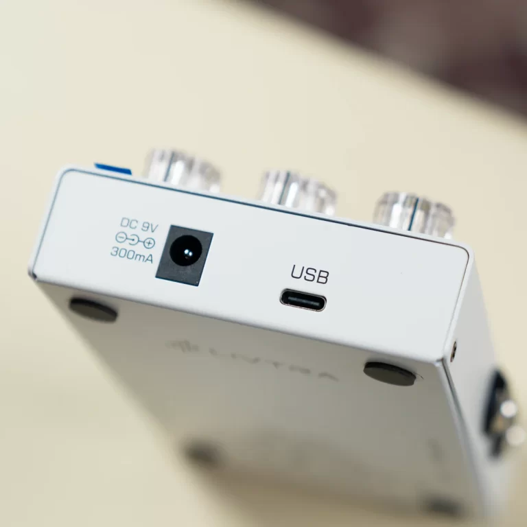 Close-up of a white electronic device showing a USB-C port labeled USB and a DC power input (300mA). ขายราคาพิเศษ
