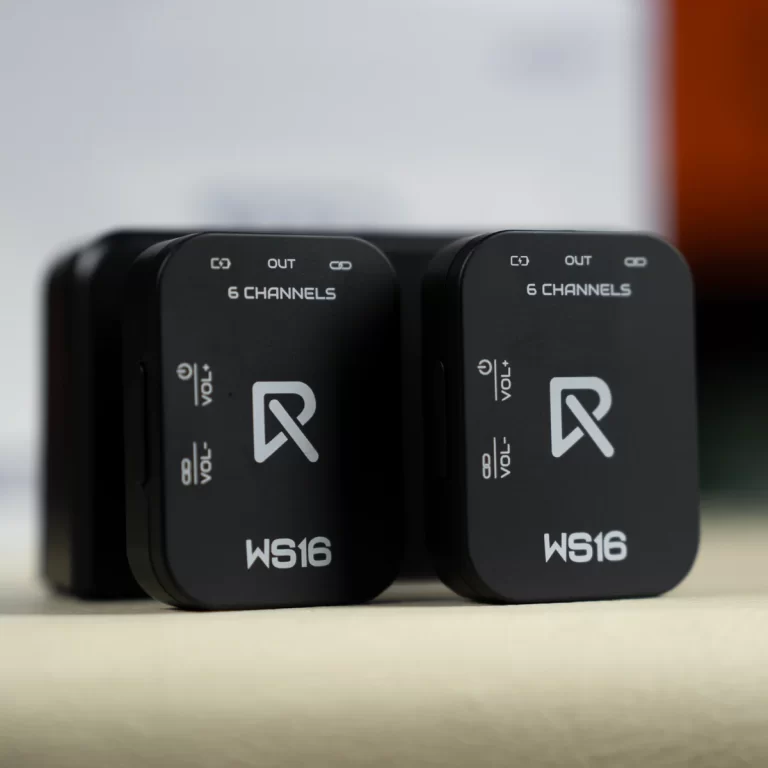 Two black WS16 wireless audio receivers side by side on a wooden surface, showing '6 CHANNELS' and a white logo. ขายราคาพิเศษ