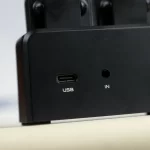 Close-up of a black device showing a USB-C port labeled USB and an input jack labeled IN as the front panel ports. ขายราคาพิเศษ