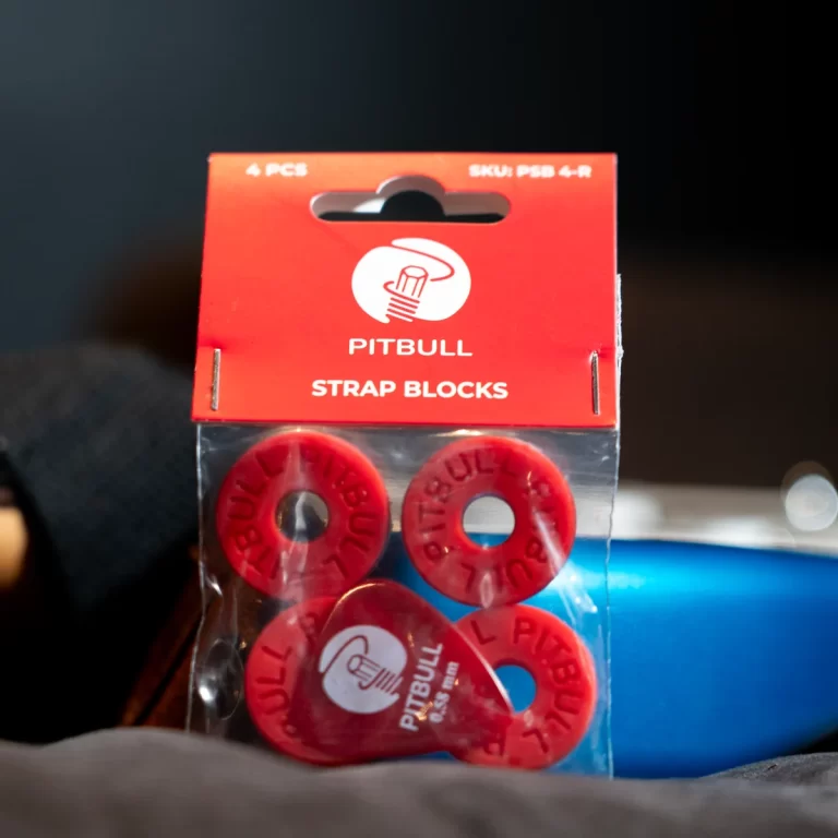 Red packaging labeled 'PITBULL STRAP BLOCKS' with four red donut-shaped blocks inside a plastic pouch ขายราคาพิเศษ