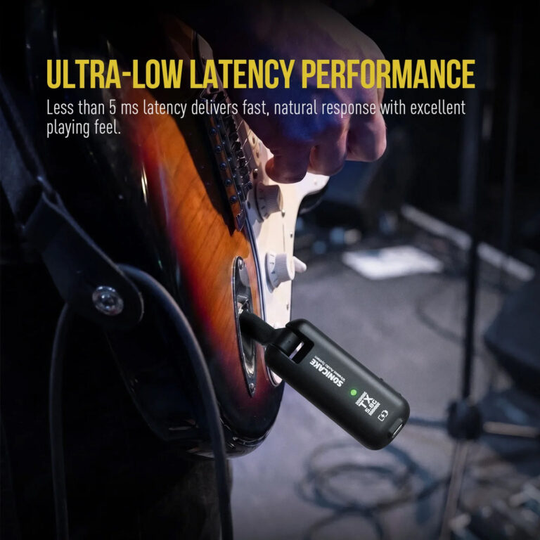 Close-up of an electric guitar being played, with a wireless receiver plugged into the output jack; overlay reads 'ULTRA-LOW LATENCY PERFORMANCE' and promo text about latency. ขายราคาพิเศษ