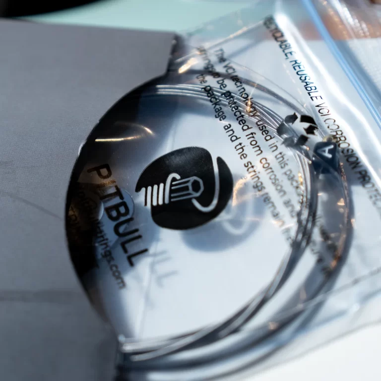 Close-up of a reflective CD inside an open plastic case, with printed text and a recycling symbol visible. ขายราคาพิเศษ