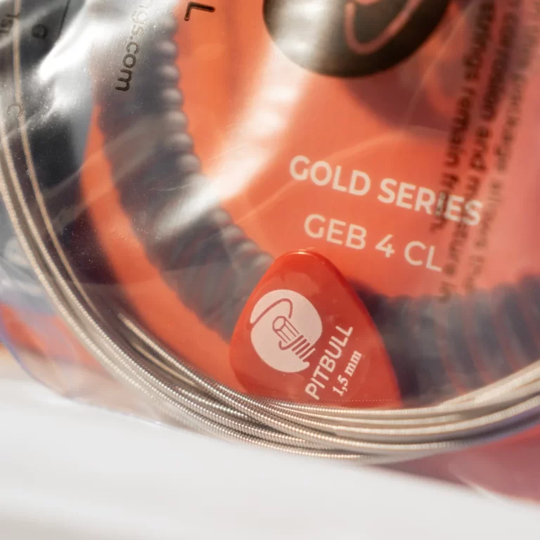 Close-up of a red plastic tag inside a clear case, showing a white Pitbull logo and 'PITBULL 1.5 ml' text. ขายราคาพิเศษ