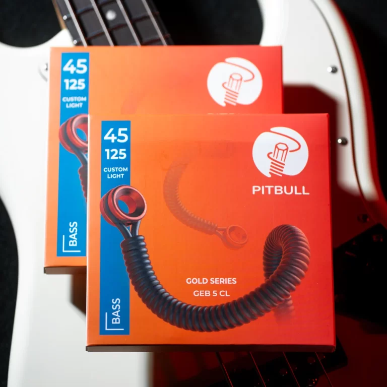 Orange Pitbull Gold Series bass guitar strings packaging with blue label reading '45 125 Custom Light' and coiled cord artwork. ขายราคาพิเศษ