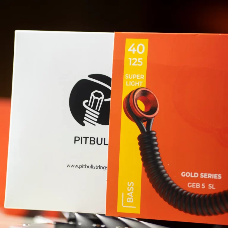 Package of Pitbull Gold Series bass guitar strings, showing 40–125 gauge on the orange box beside the Pitbull logo on a white box thematically linked. ขายราคาพิเศษ