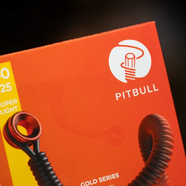 Orange packaging with a white Pitbull logo and a black coiled tube visible on the left side. ขายราคาพิเศษ