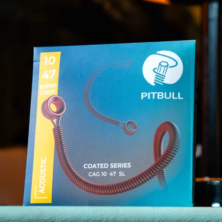 Blue Pitbull Coated Series acoustic cable box, showing a coiled cable design and yellow left banner with model details (CAG 10 47 SL). ขายราคาพิเศษ