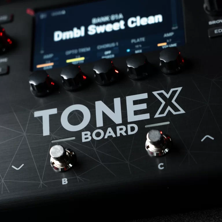 Close-up of a Tone X Board guitar effects pedal with multiple knobs, two footswitches labeled B and C, and a small display. ขายราคาพิเศษ
