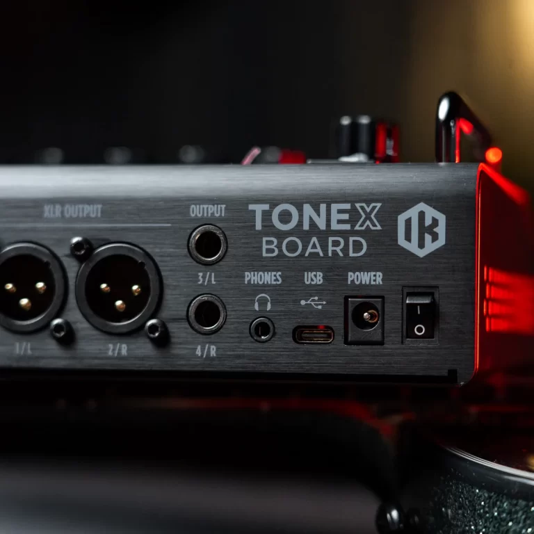 Audio interface back panel showing XLR outputs, 1/2 and 3/4 jacks, USB/phones/Power indicators labeled TONEX BOARD with a power switch nearby ขายราคาพิเศษ