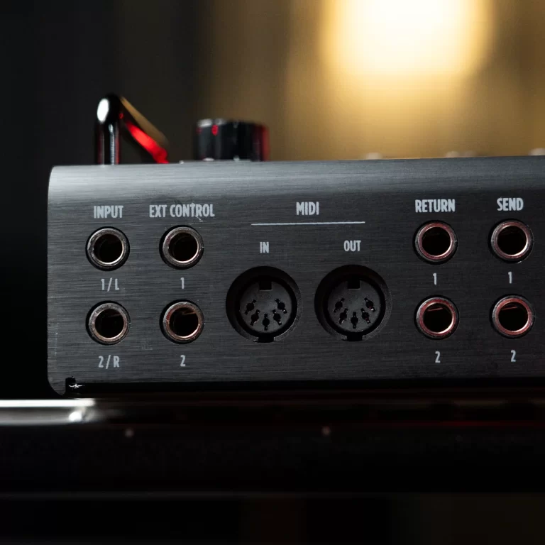 Close-up of a metal audio interface back panel showing INPUT, EXT CONTROL, MIDI IN/OUT, and RETURN/SEND 1/4-inch jacks labeled 1/L, 2/R, and 2 ขายราคาพิเศษ