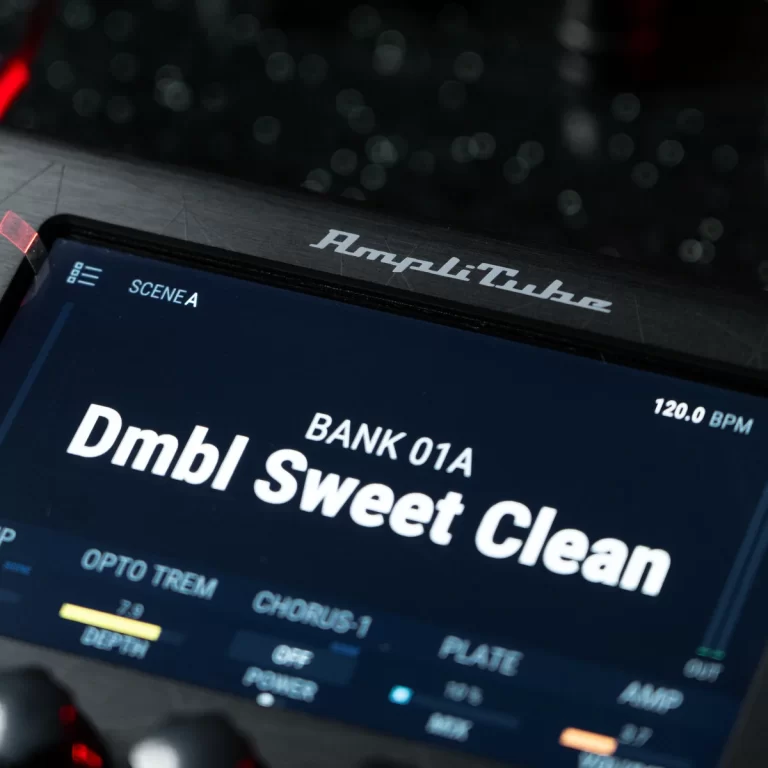 Screen shows AmpliTube interface displaying 'Dmbl Sweet Clean' patch name with SCENE A and tempo 120 BPM in the corner, on a dark device screen. ขายราคาพิเศษ
