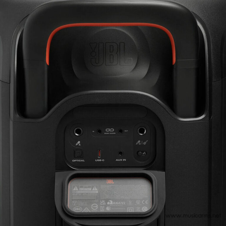 Back view of a JBL speaker with a red curved handle, showing input panel: optical, USB-C, AUX IN, and daisy-chain connectors visible beneath, with subtle JBL branding. ขายราคาพิเศษ