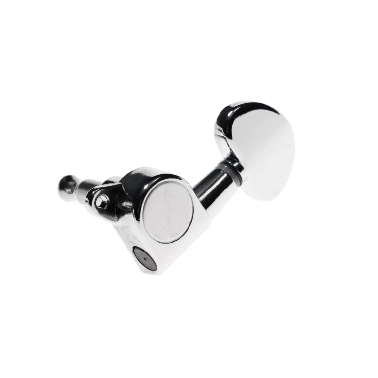 Close-up of a chrome guitar tuning peg (machine head) used to adjust string tension on a guitar headstock, isolated on white background. ขายราคาพิเศษ