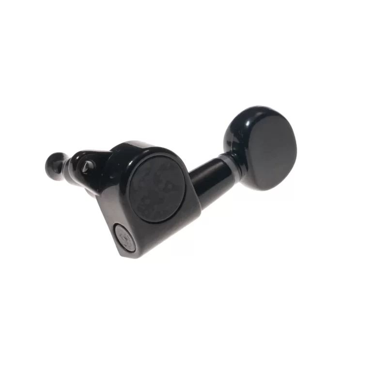 Close-up of a black guitar tuning machine head with a round knob against a white background. ขายราคาพิเศษ