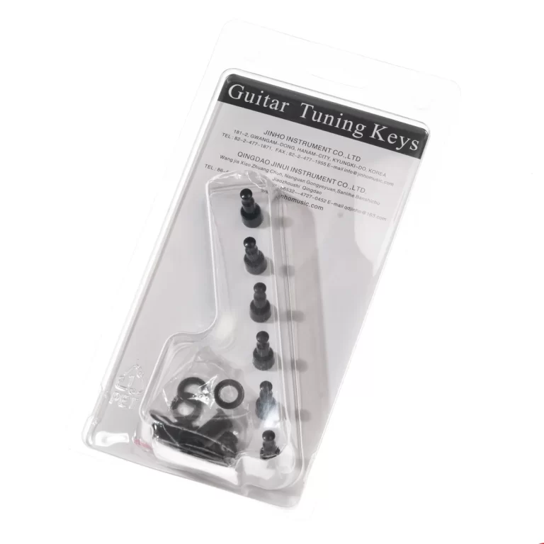 Guitar tuning key set in clear blister packaging, showing several black tuning pegs and small hardware pieces inside the package labeled 'Guitar Tuning Keys' ขายราคาพิเศษ