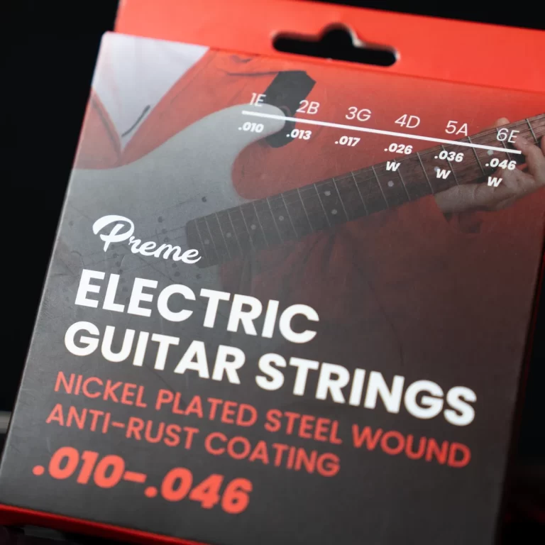 Box label for Prime electric guitar strings, nickel‑plated steel with anti‑rust coating, gauges .010–.046 ขายราคาพิเศษ