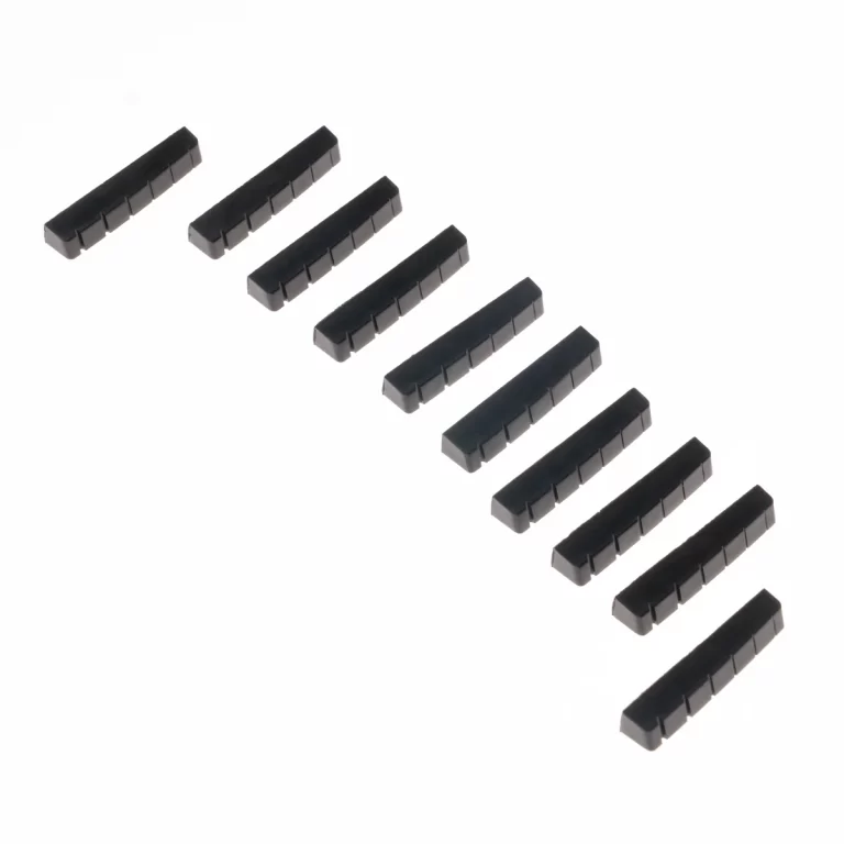 Row of small black rectangular plastic components with ridged sides, aligned diagonally. ขายราคาพิเศษ