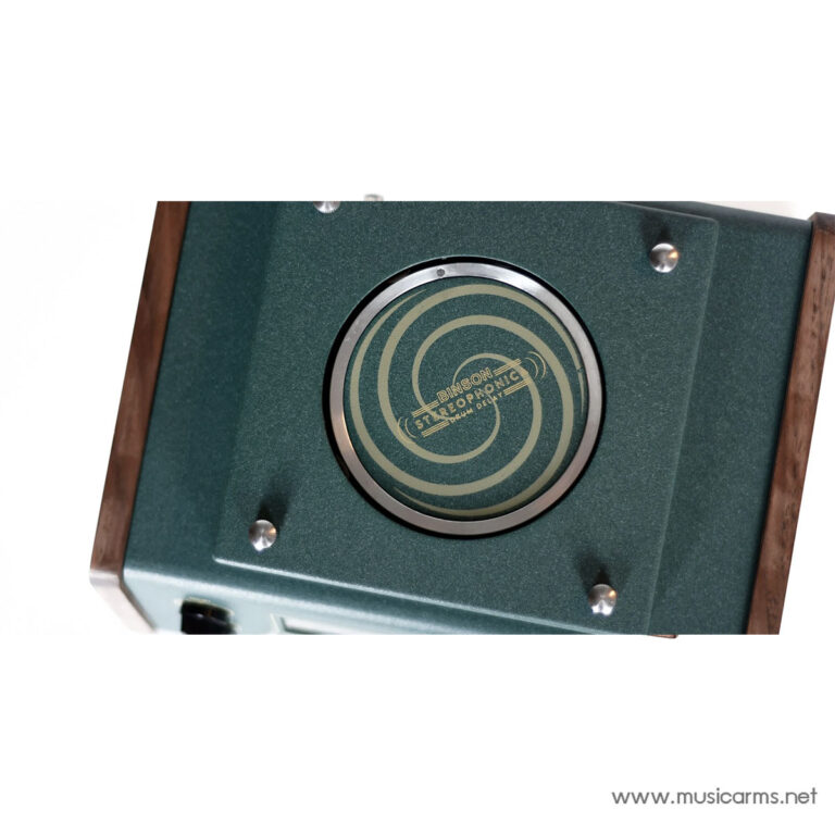 Close-up of a vintage green textured panel with a circular chrome ring and concentric circle badge, framed by wood edges. ขายราคาพิเศษ