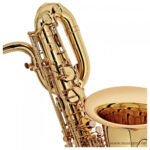 Close-up of a shiny gold saxophone showing keys and curved neck against a white background] - but avoid brackets. ขายราคาพิเศษ