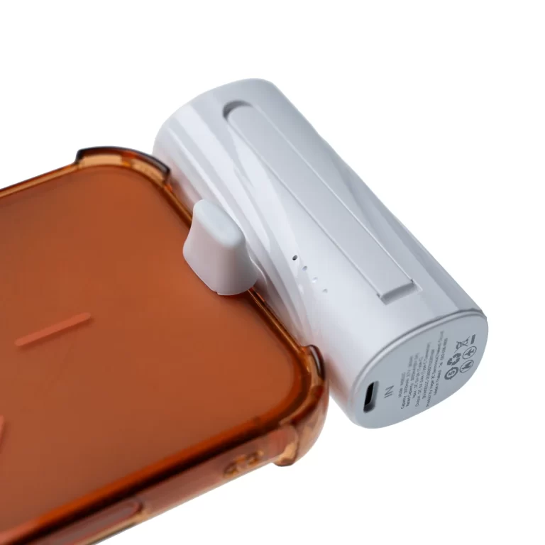 White modular charging module attached to the side of an orange phone case. ขายราคาพิเศษ