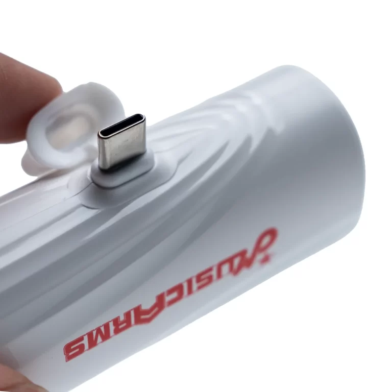 Close-up of a USB-C plug on a white cylindrical device being opened by a finger cap. ขายราคาพิเศษ