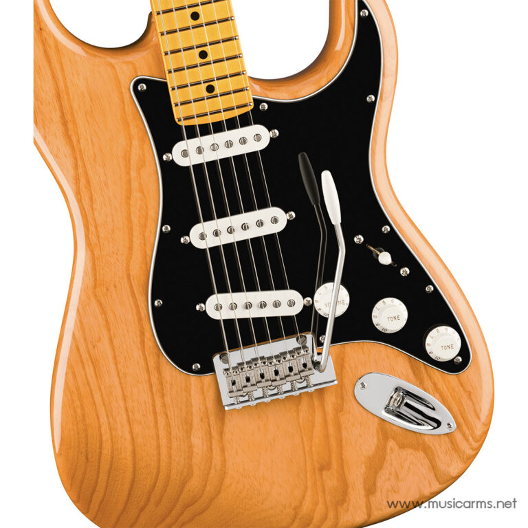 Close-up of an orange electric guitar body with a black pickguard, three pickups, and a tremolo bridge. ขายราคาพิเศษ