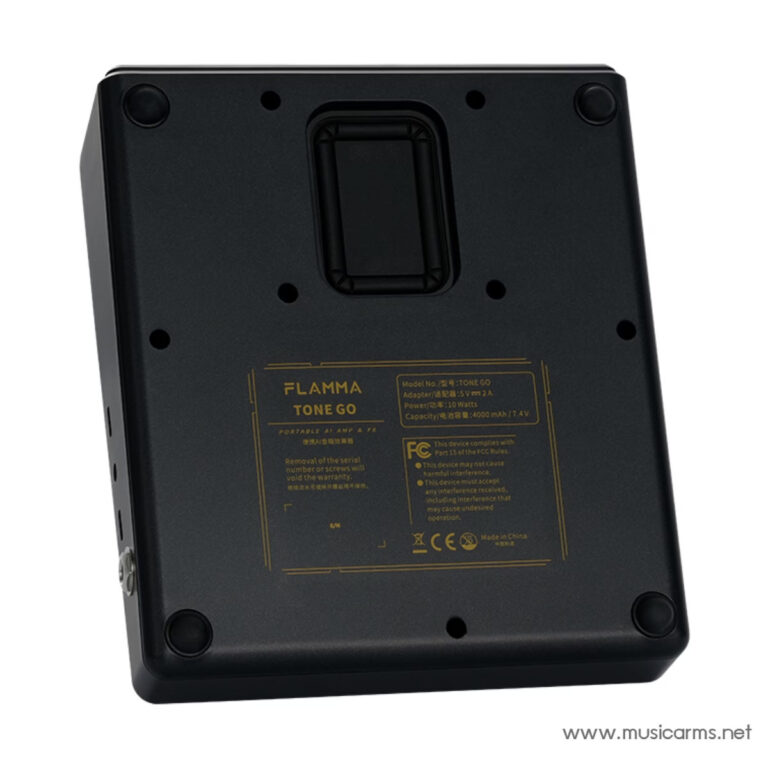 Back view of a black Flam­ma Tone Go portable speaker with a centered handle and a gold specification label on the bottom half of the panel, and a musicarms.net watermark in the corner. ขายราคาพิเศษ