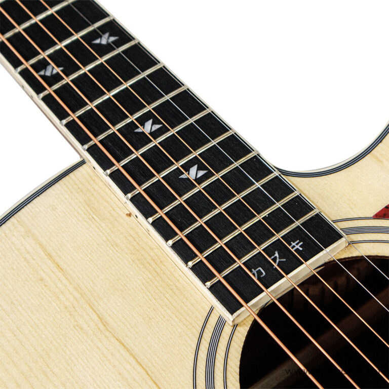 Close-up of a steel-string acoustic guitar neck showing frets, copper strings, and white dot inlays on a dark fretboard with light wood body visible. ขายราคาพิเศษ