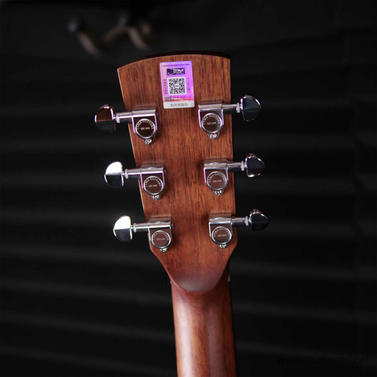 Guitar headstock with six chrome tuning pegs on a brown wood neck against a dark background ขายราคาพิเศษ